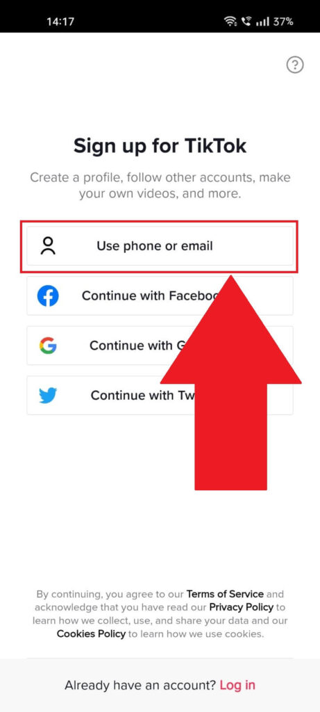 Open TikTok and select "Use phone or email"
