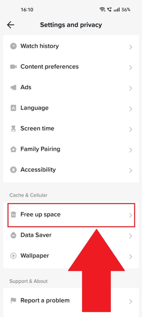 TikTok's Settings and privacy" page with the "Free up space" option highlighted in red