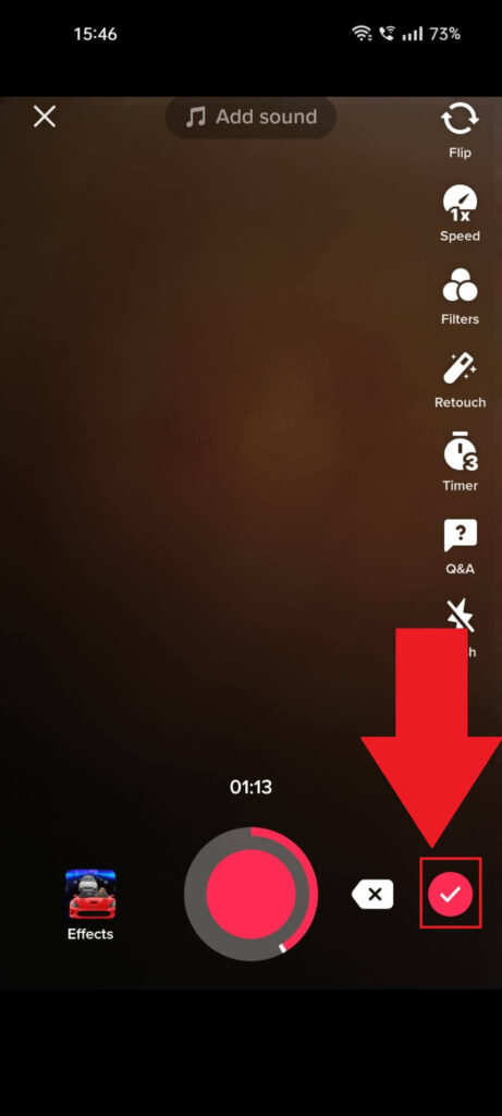 TikTok recording screen with the red checkmark icon highlighted