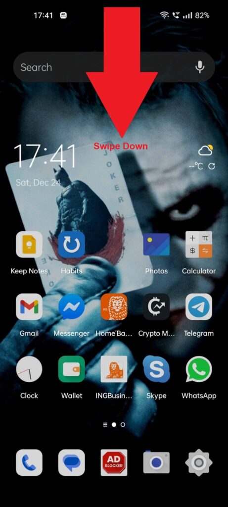 Android phone home screen showing a red arrow pointing down from the top