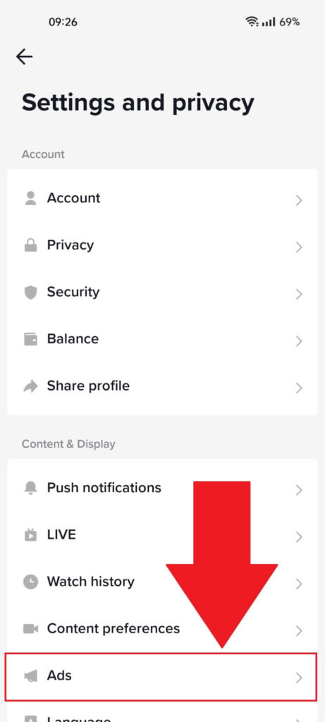 TikTok settings page with the "Ads" option highlighted in red