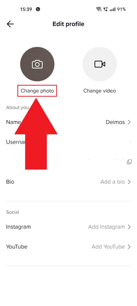 TikTok "Edit profile" page showing the "Change photo" option highlighted in red