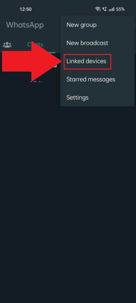 WhatsApp "Chats" page showing a menu opened where the "Linked Devices" option is highlighted and has a red arrow pointing to it