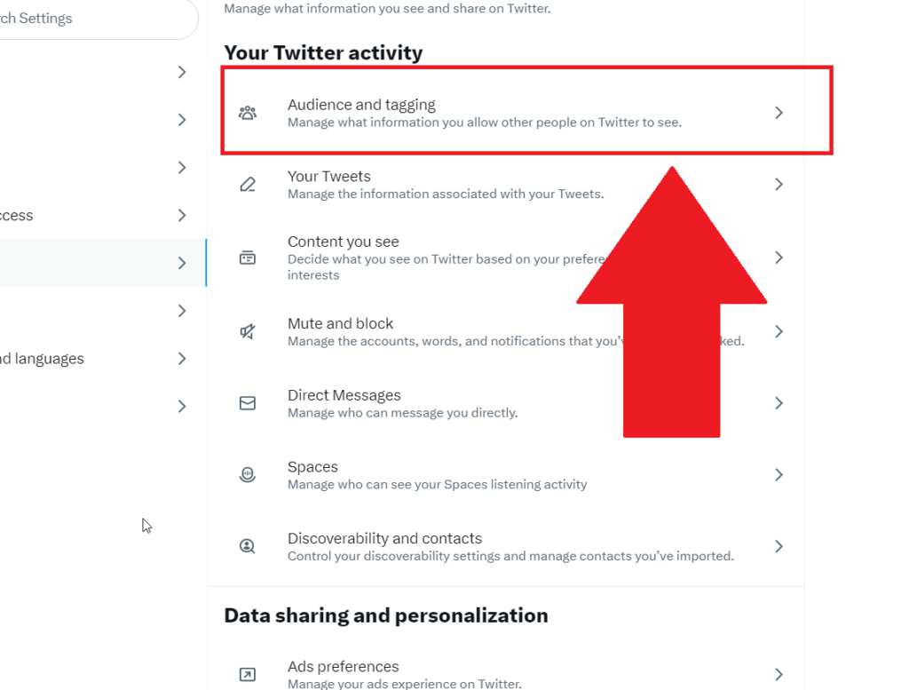 Twitter privacy settings showing the "Audience and tagging" option highlighted in red with a red arrow pointing to it