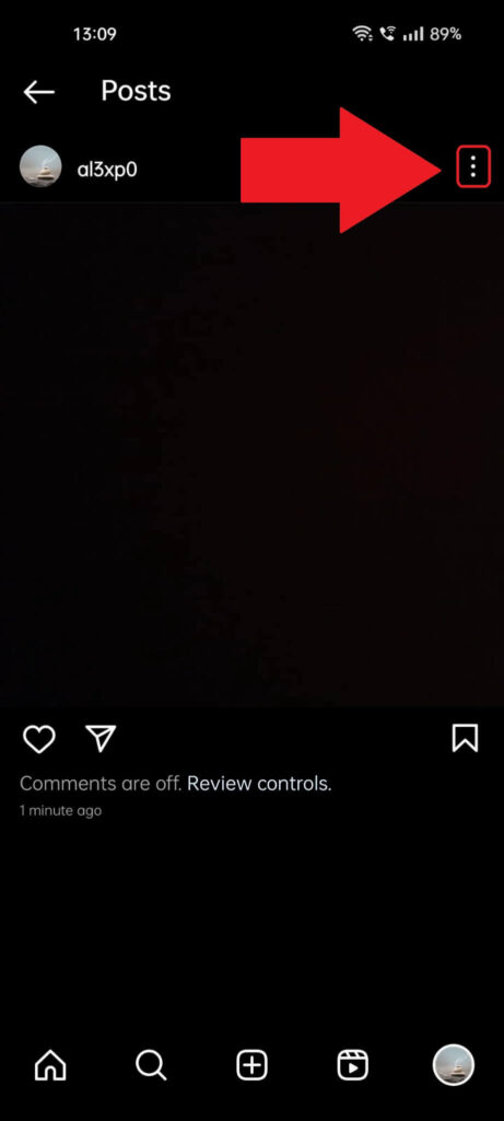 Instagram post page where the three-dot icon in the top-right corner is highlighted and has a red arrow pointing to it