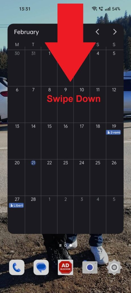 Android phone home screen showing a red arrow pointing down from the top with the message "Swipe Down" next to it
