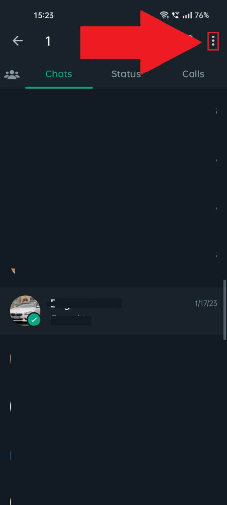 WhatsApp "Chats" page showing a chat selected and the three-dot icon highlighted in the top-right corner and a red arrow pointing to it