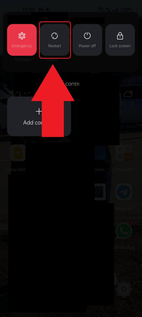 Android phone Power menu showing the "Restart" button highlighted with a red arrow pointed to it