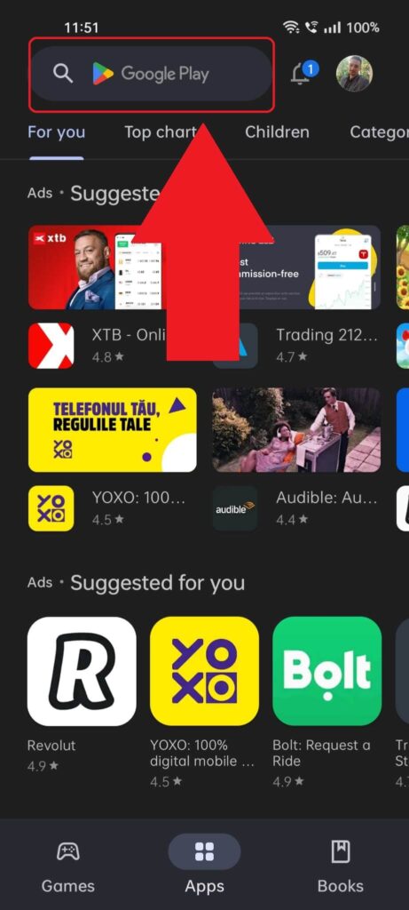 Play Store homepage showing the search bar at the top highlighted and a red arrow pointed to it